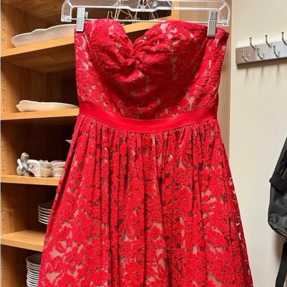 Red lace strapless Aqua dress, tan underskirt, zipper up the back, size 0